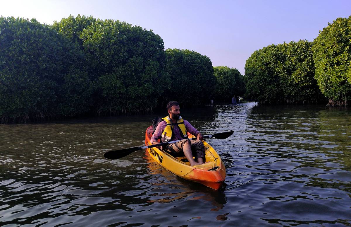 Kayak Liability Policies: Renter reviewing insurance paperwork before launching kayak at marina