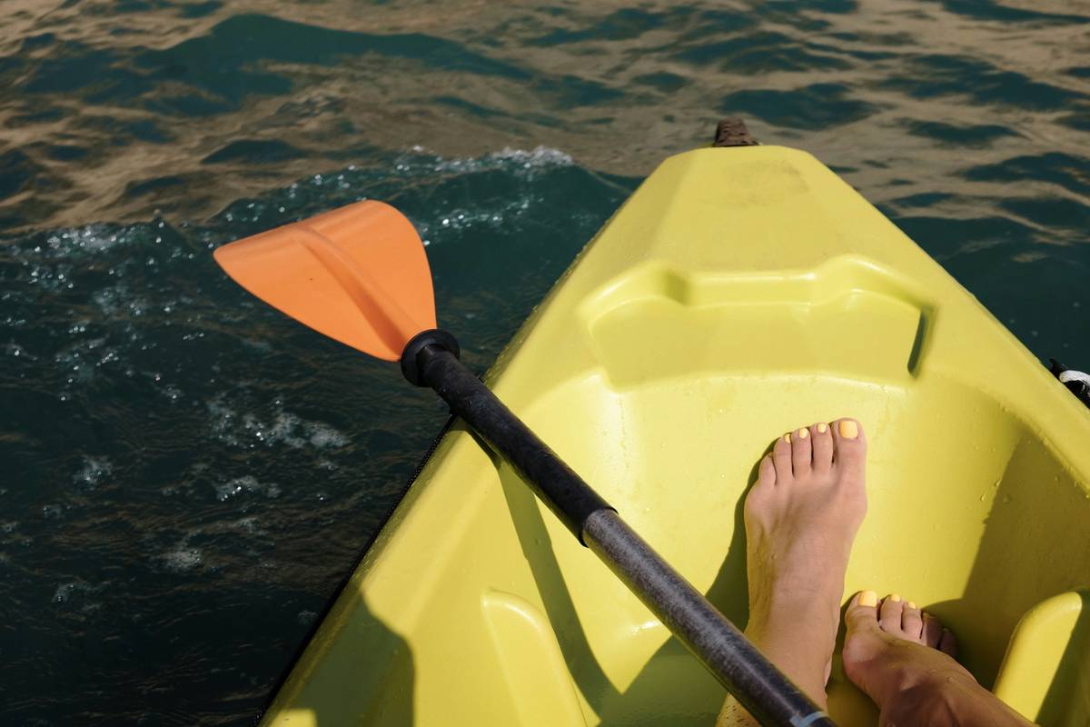 Kayak rental dock with life jackets and paddles; what is personal liability insurance protects against damages like broken gear or injuries to others